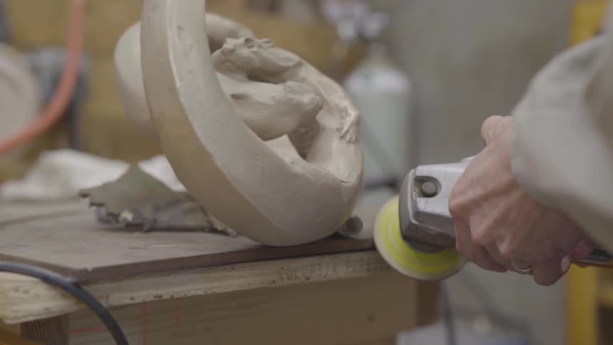 Man grinds sculpture