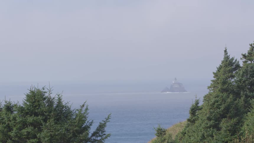 Looking out over a hillside to the ocean and an island
