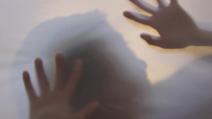A shadow of a person is shown
