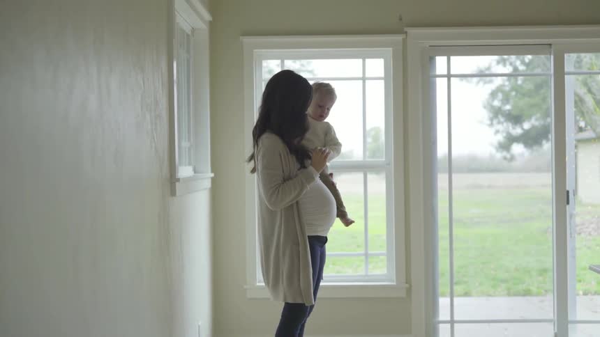A woman holding a child