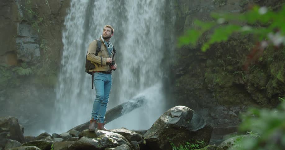 Man Exploring Waterfall