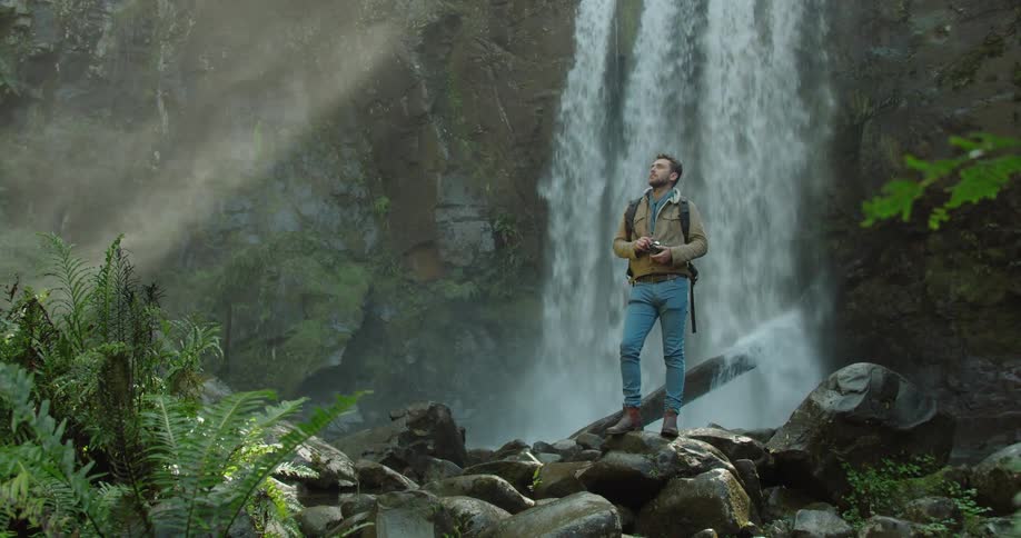 Man Exploring Waterfall