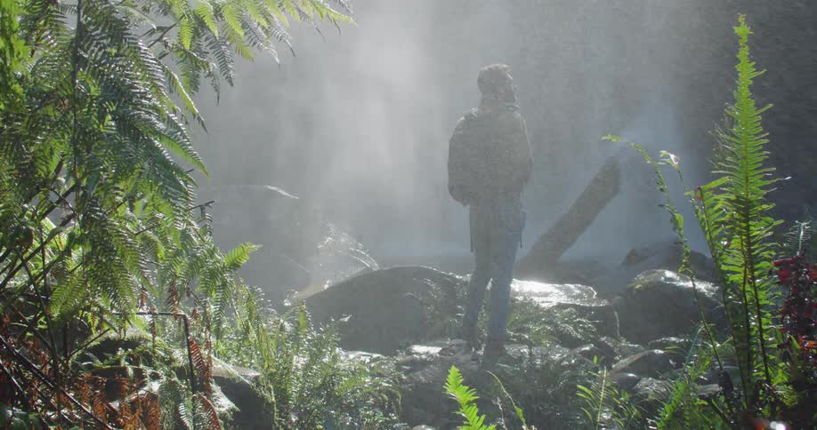 Man Exploring Waterfall