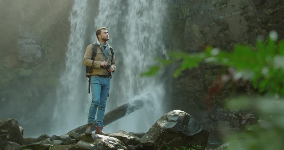 Man Exploring Waterfall