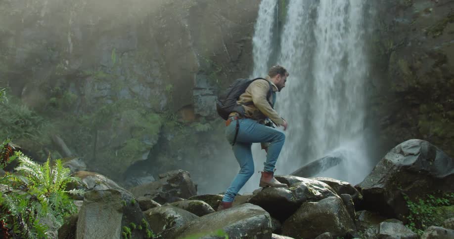 Man Exploring Waterfall