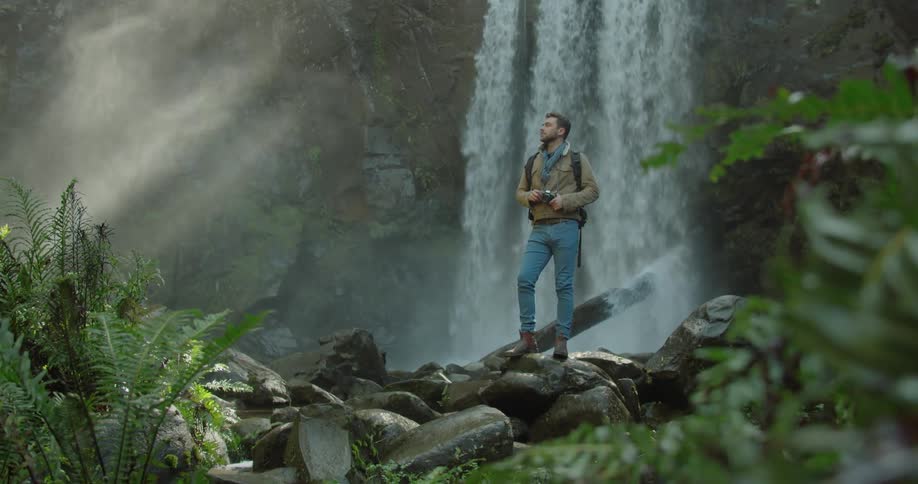 Man Exploring Waterfall
