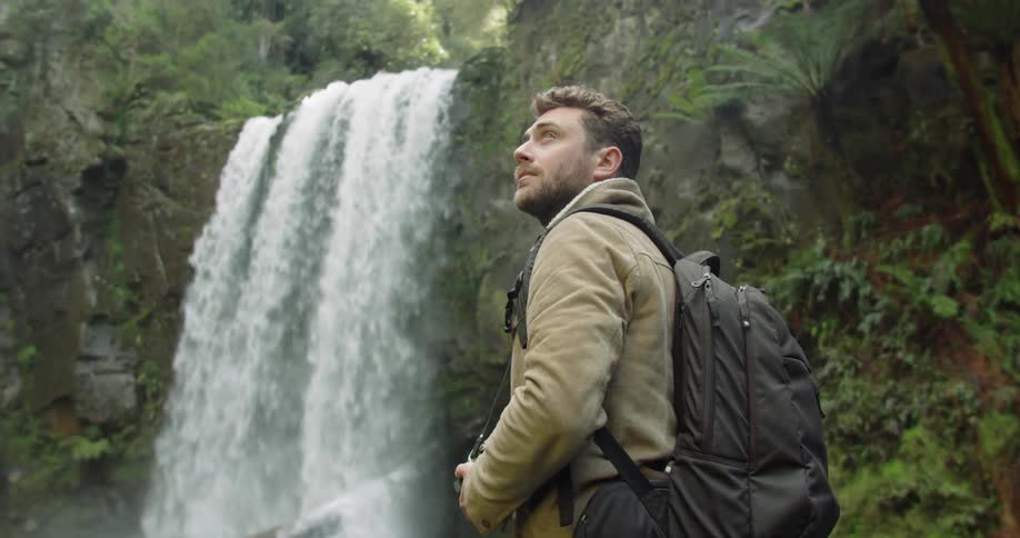 Man Exploring Waterfall