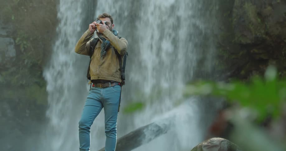 Man Exploring Waterfall