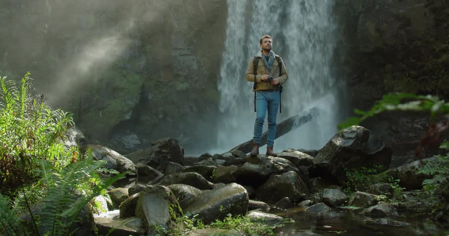 Man Exploring Waterfall