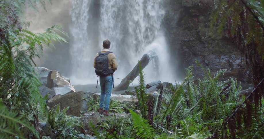 Man Exploring Waterfall