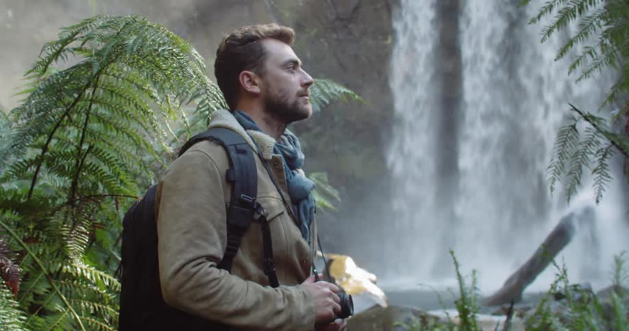 Man Exploring Waterfall