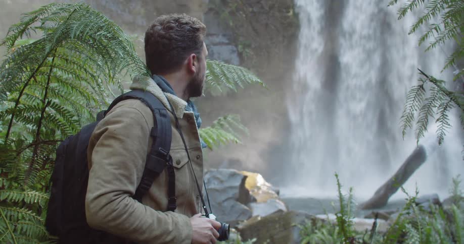 Man Exploring Waterfall