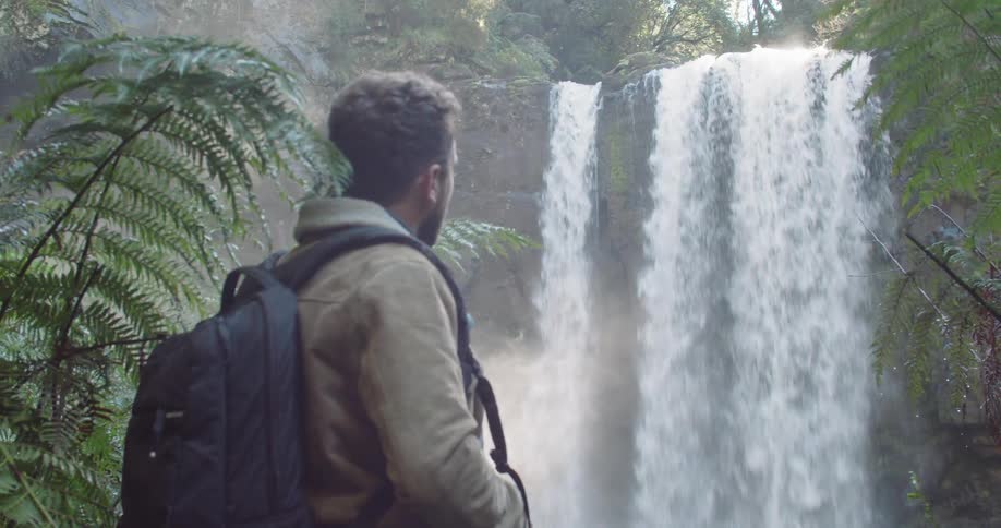Man Exploring Waterfall