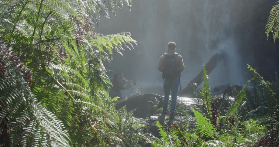 Man Exploring Waterfall