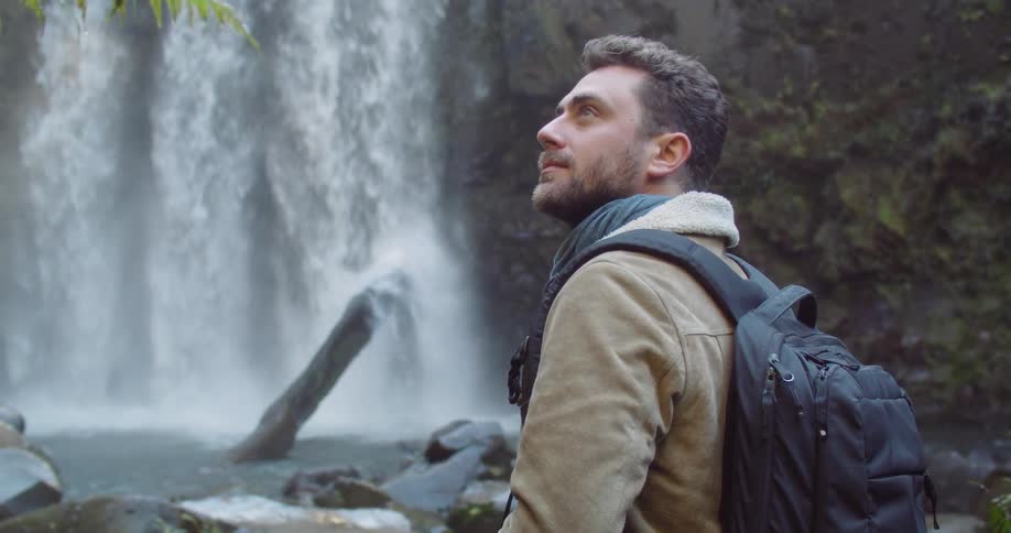 Man Exploring Waterfall