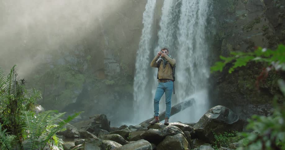 Man Exploring Waterfall