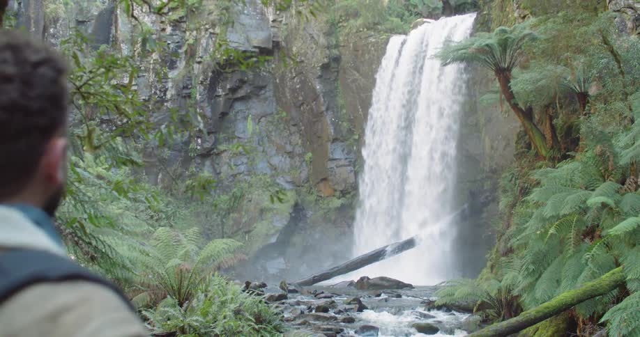 Man Exploring Waterfall