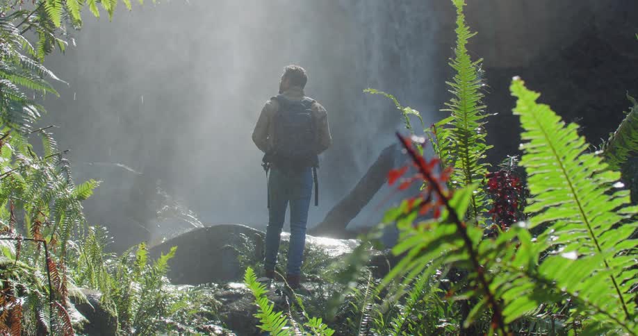 Man Exploring Waterfall