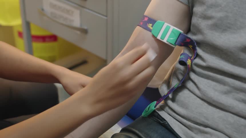 A man is having a blood test