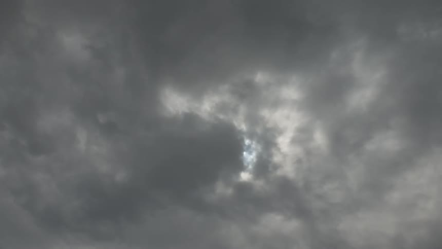 Clouds pass in front of the sun