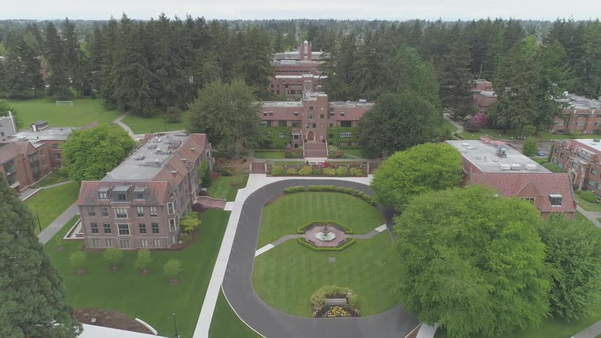 Large university buildings on a tree lined campus