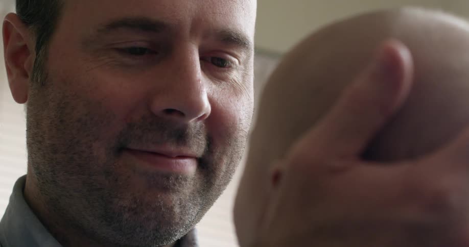 A man holds a baby