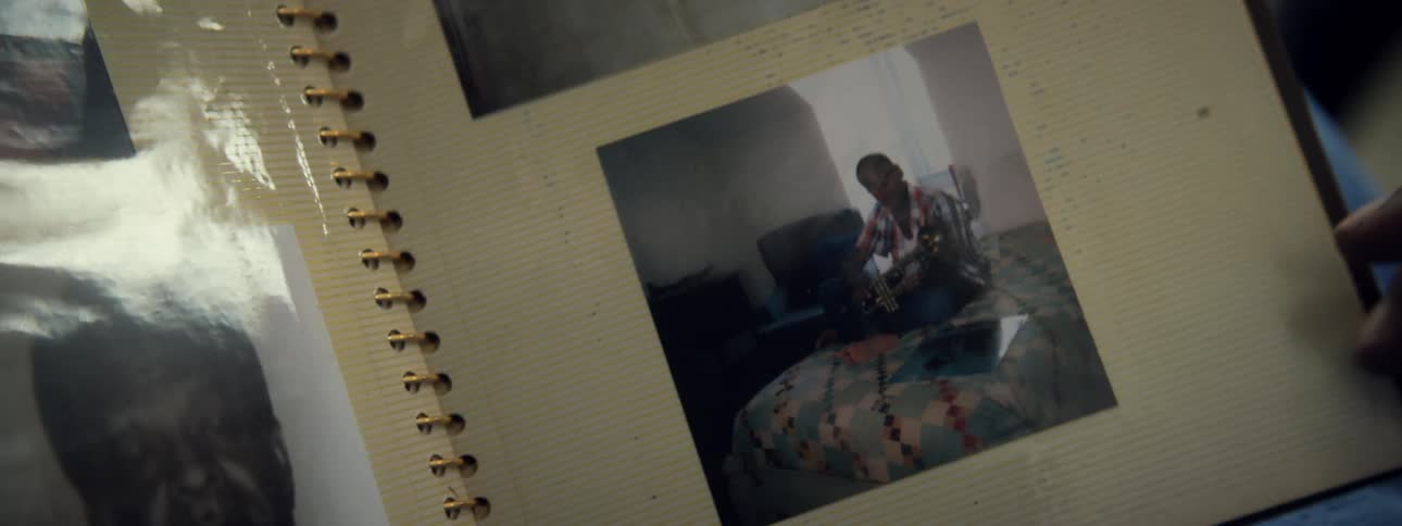 Person grabs the page of a photo book