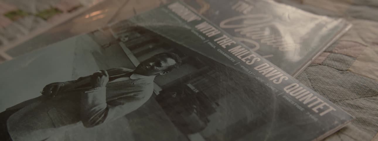 View of a miles davis record on a bed