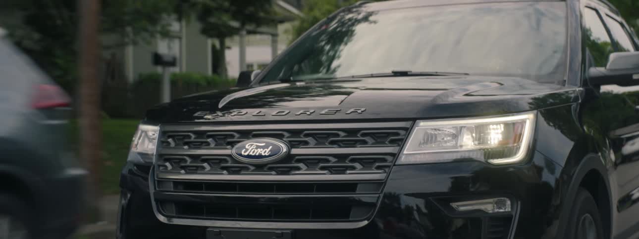 Ford explorer drives down road