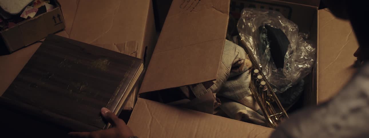 A person unpacking a box