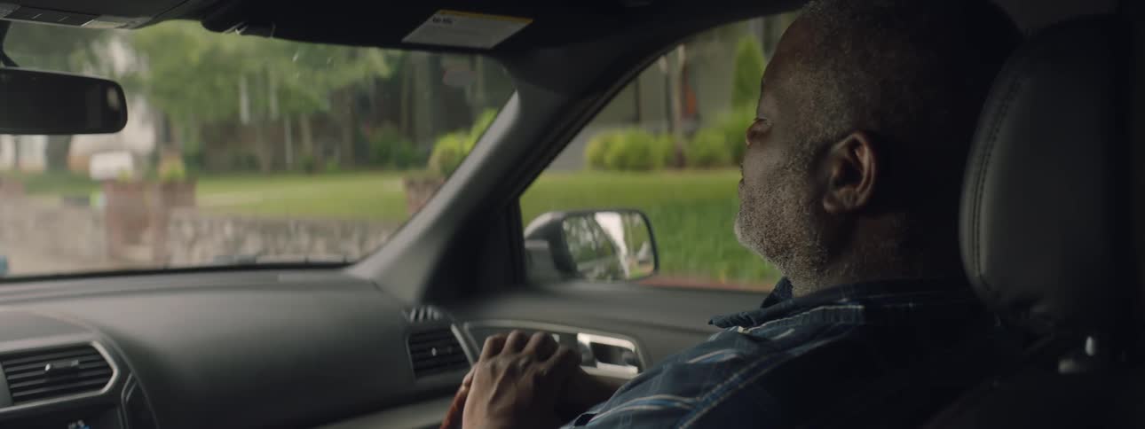 A man is sitting in a car