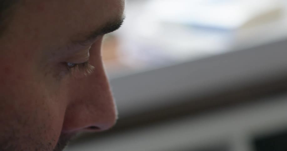 A man's face in profile and close up