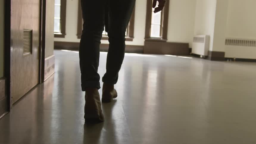 A person is walking in a building