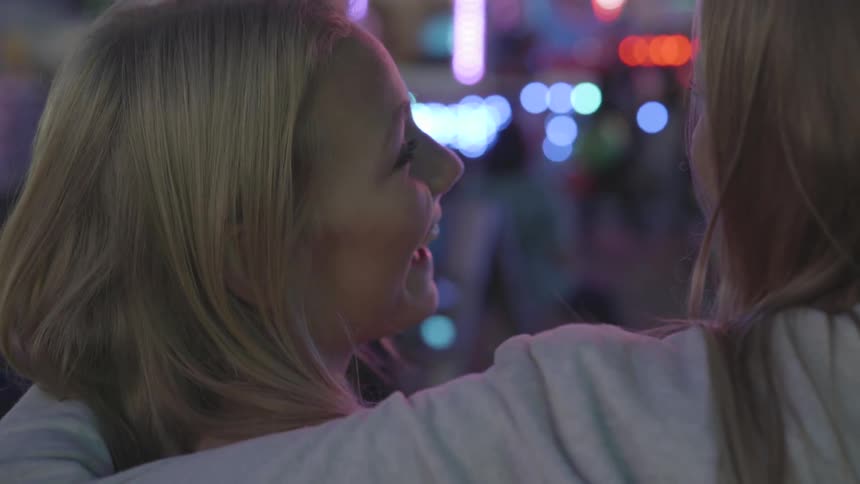Two girls laughing together