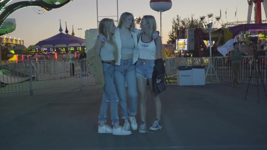 Three girls with their arms around each other