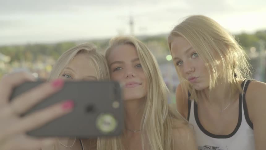 Three blonde girls take selfie