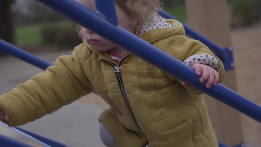 A child climbing up the stairs
