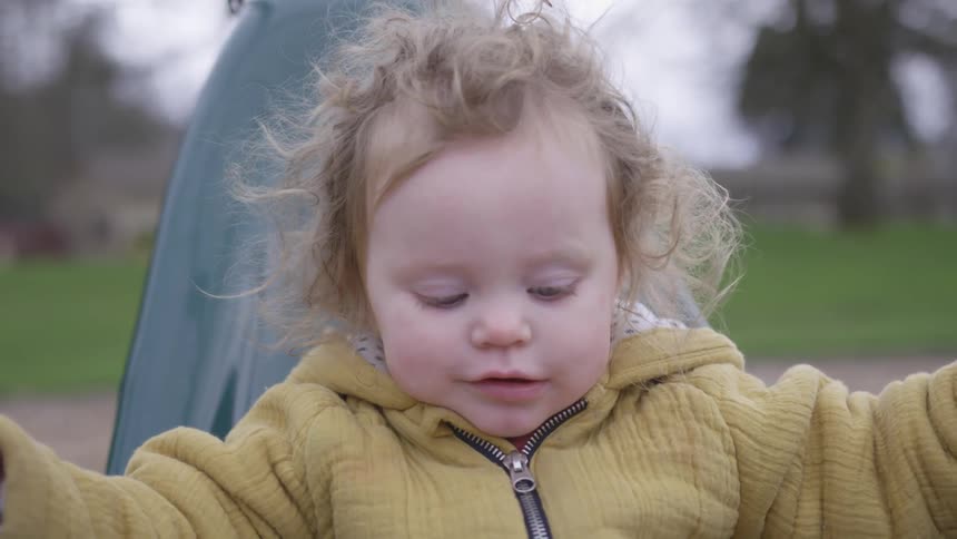 A small child on a swing