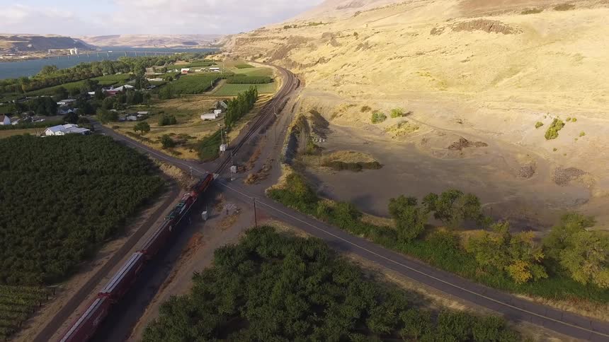 A train traveling down the railroad tracks