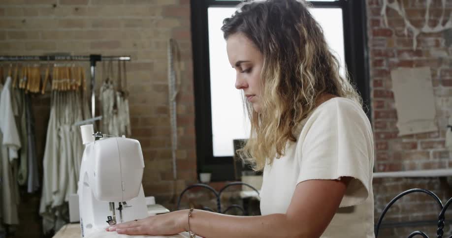 A woman using a sewing machine