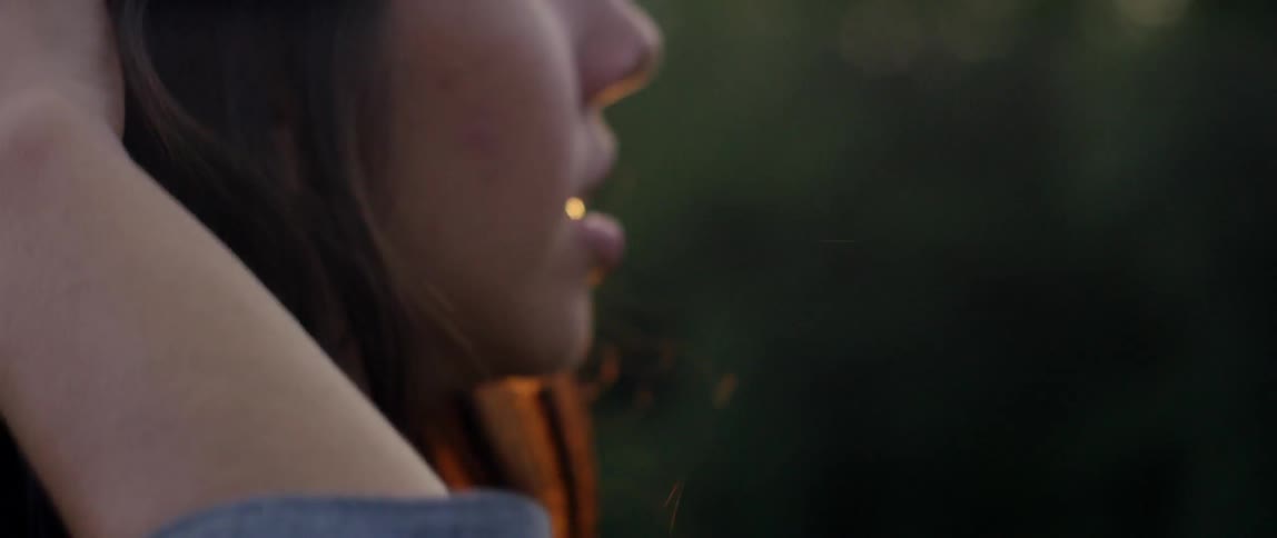 A person's hair blowing in the wind
