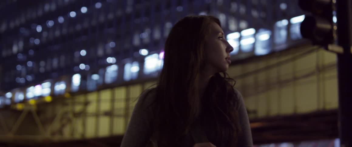 A person looking at a stoplight