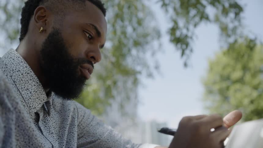A man writing in a journal