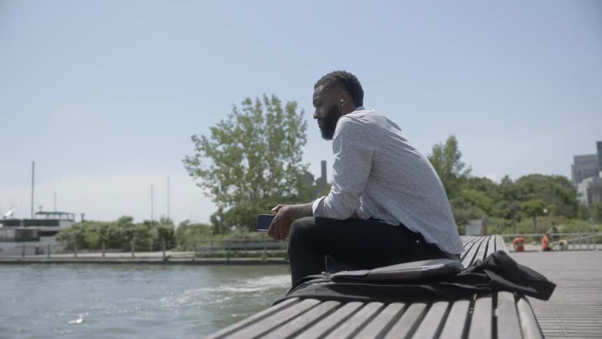 A man sitting on a park bench