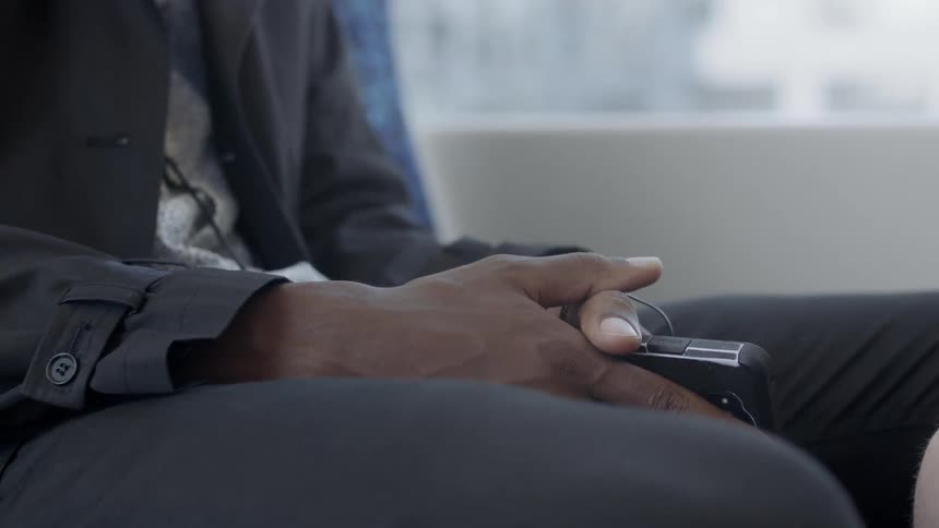 Mans lap with cell phone