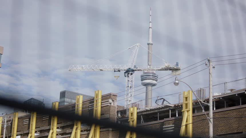 Tall tower stands behind the hydro wires