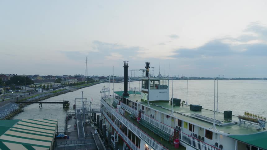A large ship sitting in the mississippi river