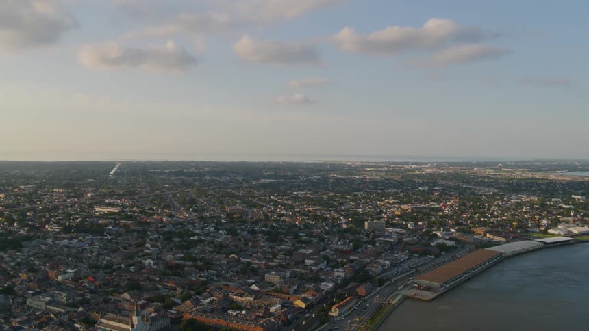 A large city on a waterfront stretches into the distance
