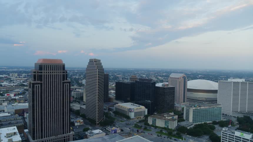 Skyscrapers and city streets under a cloudy sky