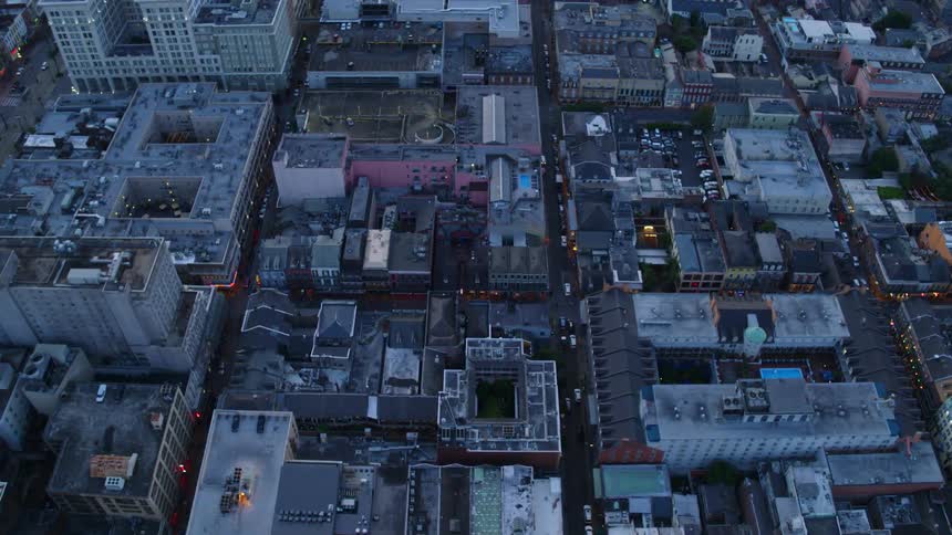 A dense city center unfolds under us